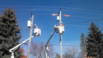 Utility workers fixing power lines